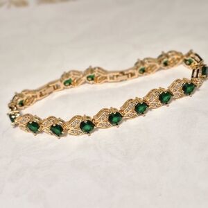Luxurious Gold Bracelet with Green Accents